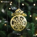 Golden snowflake ornament with crown bow detail hanging on a festive Christmas tree - Snowflake F