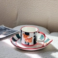 Detail of hand-painted ceramic coffee cup featuring red trim and 3D orange dog handle - Set (Cup+Plate+Spoon)-Christmas Green Stripes / Green