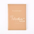 Close-up of light brown PU leather passport cover with gold embossed adventure quote - Ginger Yellow