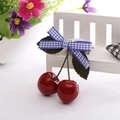 Cute red cherry hair clip with blue white gingham bow on a white wooden stand - Blue Plaid