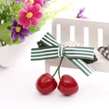 Green and white striped bow hair clip featuring realistic red cherry pendants for kids - Green Stripes