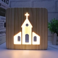 3D hollow wooden cross night light with warm LED glowing on desk with books - Church/19cm