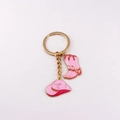 Detailed view of pink enamel cowboy hat and boot charms on a gold keychain - Pink Hat & Boots