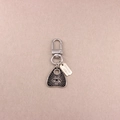 Detail of silver alloy keychain featuring a black planchette pendant with eye motif - All-seeing Eye Planchette