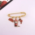 Detail of Christmas cat enamel pin with red Merry Christmas tag and candy cane charms - Standing Cat with Christmas Wreath
