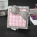 Square silver folding makeup mirror with pink quilted design and rhinestone bow - Pink