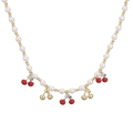 Close-up of pearl bead necklace with red cherry pendants and gold metallic accents - Gold Smooth Cherry & Red Cherry Necklace