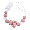 Detail of pink silicone pacifier clip with cartoon bear pendant and heart beads - Dusty Rose