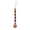 Detail of wooden beech beads with engraved stars and rainbow on silicone pacifier clip - Brick Red
