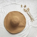 Foldable khaki straw sun hat with wide brim on white fabric for summer beach vacations - M (56-58cm) / Khaki