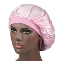 Pink silky satin bonnet cap with wide elastic hair band for night hair care on head mannequin - One Size / Pink