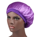Detailed view of large purple satin bonnet showing wide elastic band and smooth silk texture - One Size / Purple