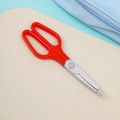 Close-up of portable red scissors with sharp silver metal blades and clear safety cap - Scissors Pen - Red (with Magnet)