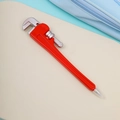 Close-up of a creative ballpoint pen shaped like a red adjustable wrench tool - Pipe Wrench Pen - Red (with Magnet)