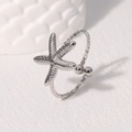Minimalistischer silberner Seestern-Ring aus Edelstahl mit verstellbarem offenem Design - Stahlfarbe