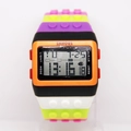 Macro detail of multi-color block watch featuring digital time, date, and week display - Black Edge Orange Black F