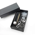 Detailed view of black leather key organizer set with metal hardware in a black gift box - Matte Black