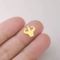 Golden bodybuilding athlete pendant charm for DIY jewelry held on fingertip - Gold Upper Body Muscle