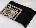 Black wool shawl featuring colorful paisley embroidery and tassels in a variant view - Black
