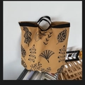 Khaki canvas tote bag with black leaf prints and durable black webbing handles - Dark Khaki Leaves
