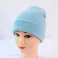 Close-up of the light blue knit beanie showing fine ribbing and classic fold-over cuff - One Size / Light Blue