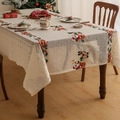 Detail shot of embroidered Santa and reindeer patterns on a vintage lace Christmas tablecloth - Santa Claus Elk