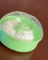 Scatola di piumino verde per neonati con coperchio trasparente e piumino morbido - Confezione in cartoncino / Verde