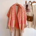 Detailed macro shot of ethnic paisley floral pattern and fringe tassels on a warm shawl - Small Floral - Pink