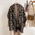 Classic leopard print thick cashmere-like scarf with fringe on a hanger with beige coat - Camel Leopard