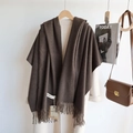 Detail of dark brown knit scarf with fringe hanging on white coat with fashion accessories - Black Coffee / 200cm