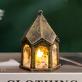 Detail of vintage Christmas LED lantern featuring painted snowman and reindeer design - Bronze - Snowman