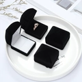 Detail of four black flocked jewelry boxes for rings and earrings on a white tray - 4.5*5*4CM / Black (Black Interior)