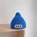 Electric blue knit beanie for babies featuring a ribbed texture and white XXX patch detail - Children X-Label Hat - Blue