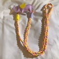 Detail of colorful woven phone lanyard with purple elephant charm and metal clasps - Back Clip + Long Strap / Purple
