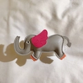 Detail of grey leather elephant pendant with pink wings and orange accents with fine stitching - Back Clip Only / Gray