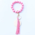 Pink wooden bead wristlet keychain featuring a faux leather tassel and metal hardware - Rose Red
