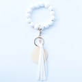 White beaded bracelet keychain with leather tassel and wood charm on blue background - Off-white