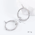 Detailed view of silver irregular coiled hoop earrings with 21mm size and 5g weight - Textured Knot Style (款式6)