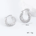 Macro detail of 20mm irregular twisted silver hoop earrings with a mirror-polished finish - 3D Twisted Style (款式10)