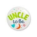 Detailed close-up of Uncle to Be tinplate badge for baby shower gender reveal party - Uncle to be