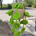 Handmade crochet hanging plant car charm with green vines and beige knit pot - No.8 (Beige Pot Lush Green Leaves)