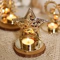 Golden star-shaped metal candle holder with hollow forest and reindeer design - 8.5x11x11cm / Pentagram