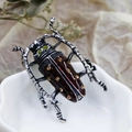 Macro shot of retro silver beetle brooch with brown enamel and yellow rhinestones - DY05-Wine Red Beetle