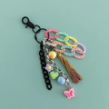 Acrylic tassel keychain with colorful plastic chains and multi-colored charms for handbags - Black