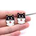 Detail of handmade enamel shiba inu dog charms for DIY earrings and keychains - Husky