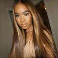 Straight long brown wig with blonde highlights shown on model in home setting - Golden Blonde Highlights / Brown