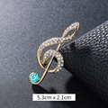 Golden G-clef musical note brooch with sparkling white crystals and blue stone 5.3x2.1cm - Blue Rhinestone Treble Clef Gold (XD9424)