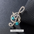 Golden musical note brooch with sparkling clear rhinestones and blue crystals - Double Blue Rhinestone Treble Clef Gold (XD9425)