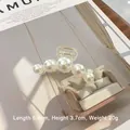 Elegante pinza per capelli media con cinque perle bianche su base in acrilico - Cinque Perle Medio (20#)