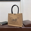 Linen tote bag with cat pattern, black rope handles and a secure snap closure - Dog